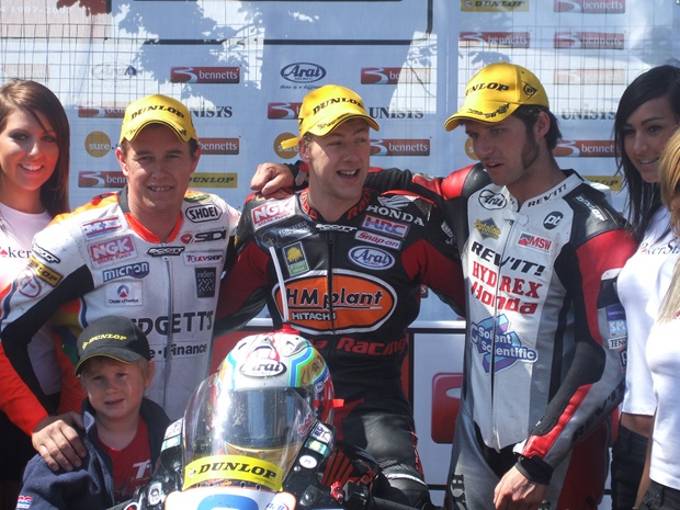 John McGuinness (left) celebrates with Ian Hutchinson (centre) and Guy Martin